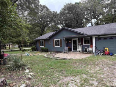 Charming Corner Lot nestled in the serene, gated community of on Holly Lake Ranch Golf Club in Texas - for sale on GolfHomes.com, golf home, golf lot