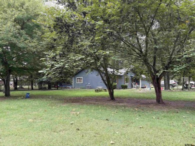 Charming Corner Lot nestled in the serene, gated community of on Holly Lake Ranch Golf Club in Texas - for sale on GolfHomes.com, golf home, golf lot