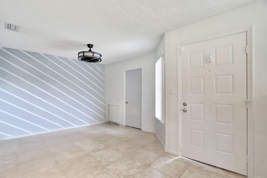 Turnkey + income-producing in sought-after Woodmont . This 3BD/2 on Woodmont Country Club in Florida - for sale on GolfHomes.com, golf home, golf lot