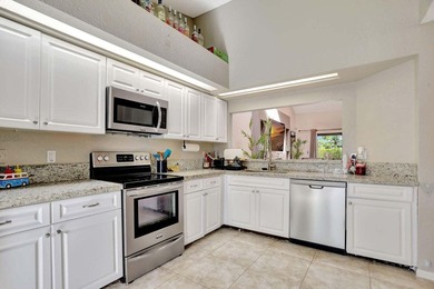 Turnkey + income-producing in sought-after Woodmont . This 3BD/2 on Woodmont Country Club in Florida - for sale on GolfHomes.com, golf home, golf lot