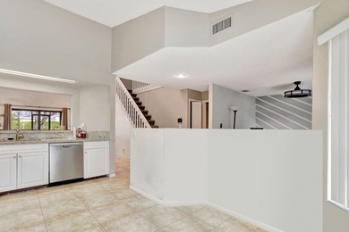 Turnkey + income-producing in sought-after Woodmont . This 3BD/2 on Woodmont Country Club in Florida - for sale on GolfHomes.com, golf home, golf lot