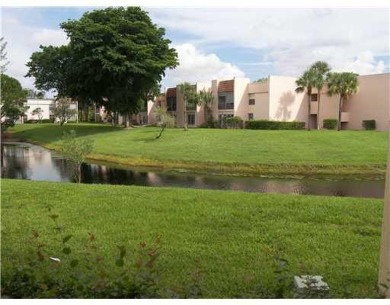 HIGHLY DESIRABLE 1ST FLOOR w/SERENE LAKE VIEWS* 2/2 HOME IN AN on Delray Beach Golf Club in Florida - for sale on GolfHomes.com, golf home, golf lot