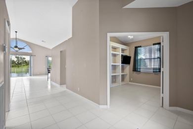 Soak in serene lake views with a backdrop of the golf course in on Santa Lucia River Club in Florida - for sale on GolfHomes.com, golf home, golf lot