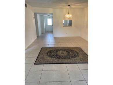 HIGHLY DESIRABLE 1ST FLOOR w/SERENE LAKE VIEWS* 2/2 HOME IN AN on Delray Beach Golf Club in Florida - for sale on GolfHomes.com, golf home, golf lot