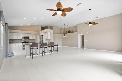 Soak in serene lake views with a backdrop of the golf course in on Santa Lucia River Club in Florida - for sale on GolfHomes.com, golf home, golf lot