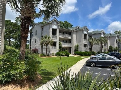 This corner unit golf course condo is tucked away in a serene on True Blue Plantation in South Carolina - for sale on GolfHomes.com, golf home, golf lot