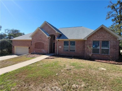 Discover your dream home on the #6 green in Hilltop Lakes! This on Hilltop Lakes Resort Golf Club in Texas - for sale on GolfHomes.com, golf home, golf lot