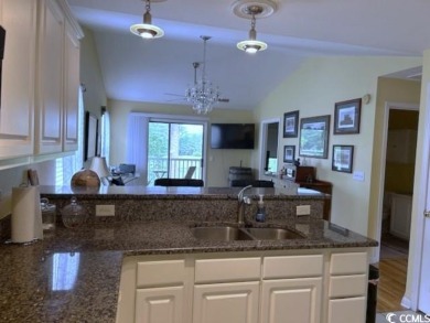 This corner unit golf course condo is tucked away in a serene on True Blue Plantation in South Carolina - for sale on GolfHomes.com, golf home, golf lot