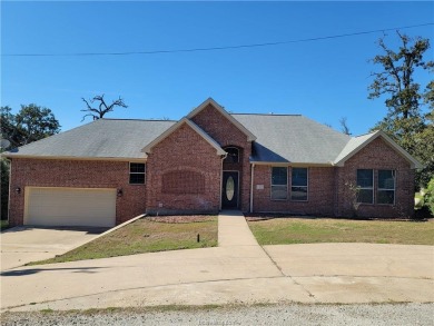 Discover your dream home on the #6 green in Hilltop Lakes! This on Hilltop Lakes Resort Golf Club in Texas - for sale on GolfHomes.com, golf home, golf lot