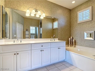 This beautifully maintained Sandpiper home in HERONS GLEN on Herons Glen Golf and Country Club in Florida - for sale on GolfHomes.com, golf home, golf lot