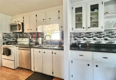 Welcome to this lovingly maintained and fully furnished on Fairway Village Golf Course in Florida - for sale on GolfHomes.com, golf home, golf lot