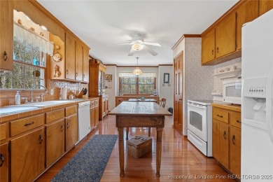 Say *Welcome Home* to this adorable English cottage-style home on Carolina Trace Country Club in North Carolina - for sale on GolfHomes.com, golf home, golf lot