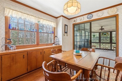 Say *Welcome Home* to this adorable English cottage-style home on Carolina Trace Country Club in North Carolina - for sale on GolfHomes.com, golf home, golf lot