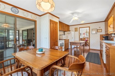Say *Welcome Home* to this adorable English cottage-style home on Carolina Trace Country Club in North Carolina - for sale on GolfHomes.com, golf home, golf lot