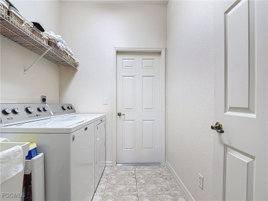 This beautifully maintained Sandpiper home in HERONS GLEN on Herons Glen Golf and Country Club in Florida - for sale on GolfHomes.com, golf home, golf lot