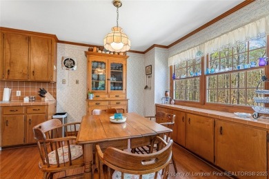 Say *Welcome Home* to this adorable English cottage-style home on Carolina Trace Country Club in North Carolina - for sale on GolfHomes.com, golf home, golf lot