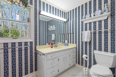 Say *Welcome Home* to this adorable English cottage-style home on Carolina Trace Country Club in North Carolina - for sale on GolfHomes.com, golf home, golf lot
