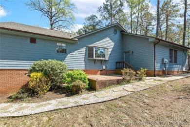 Say *Welcome Home* to this adorable English cottage-style home on Carolina Trace Country Club in North Carolina - for sale on GolfHomes.com, golf home, golf lot