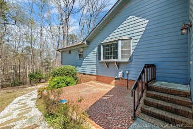 Say *Welcome Home* to this adorable English cottage-style home on Carolina Trace Country Club in North Carolina - for sale on GolfHomes.com, golf home, golf lot