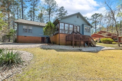 Say *Welcome Home* to this adorable English cottage-style home on Carolina Trace Country Club in North Carolina - for sale on GolfHomes.com, golf home, golf lot