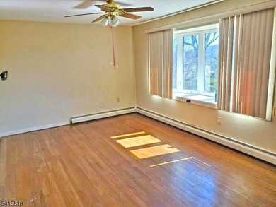 THIS RANCH BOASTS AN OPEN FLOOR PLAN WITH THE FORMAL LIVING ROOM on High Bridge Hills Golf Club in New Jersey - for sale on GolfHomes.com, golf home, golf lot