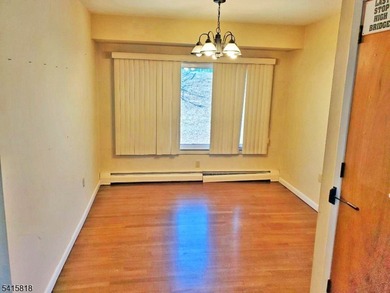 THIS RANCH BOASTS AN OPEN FLOOR PLAN WITH THE FORMAL LIVING ROOM on High Bridge Hills Golf Club in New Jersey - for sale on GolfHomes.com, golf home, golf lot