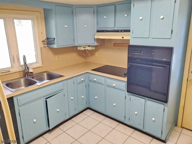 THIS RANCH BOASTS AN OPEN FLOOR PLAN WITH THE FORMAL LIVING ROOM on High Bridge Hills Golf Club in New Jersey - for sale on GolfHomes.com, golf home, golf lot