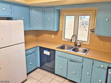 THIS RANCH BOASTS AN OPEN FLOOR PLAN WITH THE FORMAL LIVING ROOM on High Bridge Hills Golf Club in New Jersey - for sale on GolfHomes.com, golf home, golf lot