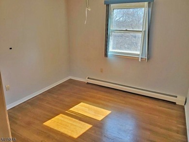 THIS RANCH BOASTS AN OPEN FLOOR PLAN WITH THE FORMAL LIVING ROOM on High Bridge Hills Golf Club in New Jersey - for sale on GolfHomes.com, golf home, golf lot