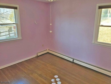 THIS RANCH BOASTS AN OPEN FLOOR PLAN WITH THE FORMAL LIVING ROOM on High Bridge Hills Golf Club in New Jersey - for sale on GolfHomes.com, golf home, golf lot