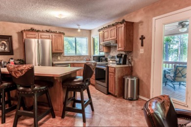 Welcome to your ideal lakefront retreat in the highly desirable on Holly Lake Ranch Golf Club in Texas - for sale on GolfHomes.com, golf home, golf lot