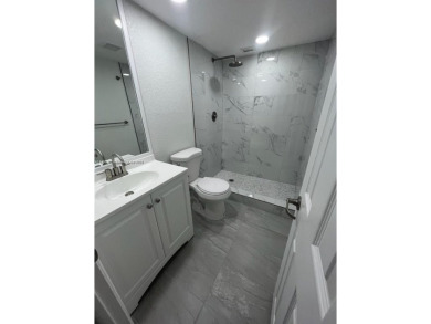 This beautifully remodeled 2-bedroom, 2-bath condo offers on Palm-Aire Country Club and Resort - Palms in Florida - for sale on GolfHomes.com, golf home, golf lot
