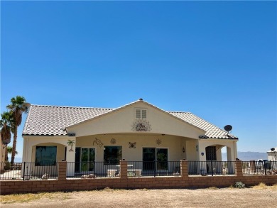 Situated gracefully between the 11th and 12th holes of the on Desert Lakes Golf Course in Arizona - for sale on GolfHomes.com, golf home, golf lot