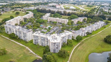 This beautifully remodeled 2-bedroom, 2-bath condo offers on Palm-Aire Country Club and Resort - Palms in Florida - for sale on GolfHomes.com, golf home, golf lot
