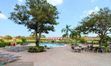 Motivated Owner! Bring All Offers! This 1st floor lakefront unit on Sunrise Country Club in Florida - for sale on GolfHomes.com, golf home, golf lot