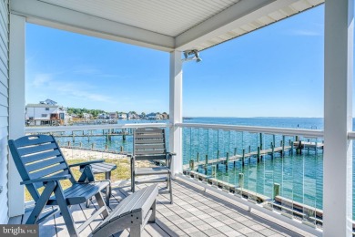 ABSOLUTE STUNNER!! Waterfront living on the Chincoteague Bay on Captains Cove Golf and Yacht Club in Virginia - for sale on GolfHomes.com, golf home, golf lot