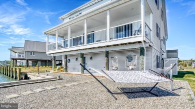 ABSOLUTE STUNNER!! Waterfront living on the Chincoteague Bay on Captains Cove Golf and Yacht Club in Virginia - for sale on GolfHomes.com, golf home, golf lot