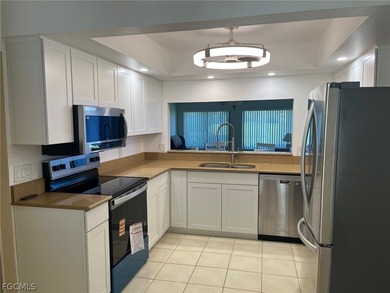 Desirable first floor end unit condo with 2 bedrooms and 2 on Seven Lakes Golf and Tennis Community in Florida - for sale on GolfHomes.com, golf home, golf lot