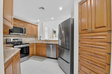 Updated, Beautiful lake view first floor  Villa/coach home on Westchester Golf and Country Club in Florida - for sale on GolfHomes.com, golf home, golf lot