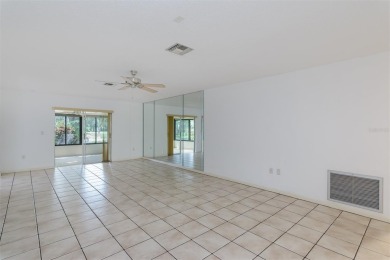 Tucked beneath the shade of moss-draped oaks and overlooking on Tarpon Woods Golf Club in Florida - for sale on GolfHomes.com, golf home, golf lot