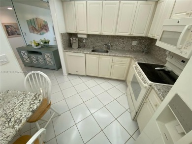 GATED COMMUNITY! ONE BED ONE BATH CONDO WITH LAKE VIEW FROM BACK on Wynmoor Golf Course in Florida - for sale on GolfHomes.com, golf home, golf lot