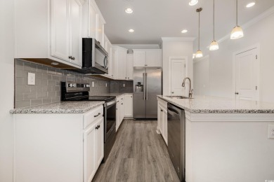 Welcome to this stunning 4-bedroom, 2.5-bathroom townhome on Barefoot Resort and Golf Club  in South Carolina - for sale on GolfHomes.com, golf home, golf lot