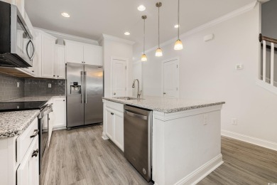 Welcome to this stunning 4-bedroom, 2.5-bathroom townhome on Barefoot Resort and Golf Club  in South Carolina - for sale on GolfHomes.com, golf home, golf lot