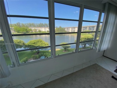 GATED COMMUNITY! ONE BED ONE BATH CONDO WITH LAKE VIEW FROM BACK on Wynmoor Golf Course in Florida - for sale on GolfHomes.com, golf home, golf lot