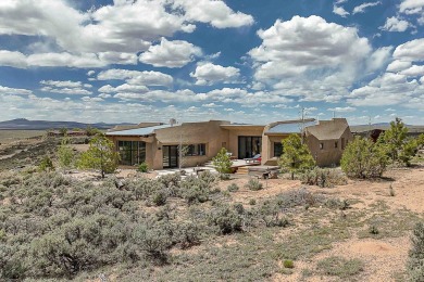 Live inside a work of art in this  Artist's Dream Dwelling in on Taos Country Club in New Mexico - for sale on GolfHomes.com, golf home, golf lot