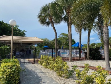 GATED COMMUNITY! ONE BED ONE BATH CONDO WITH LAKE VIEW FROM BACK on Wynmoor Golf Course in Florida - for sale on GolfHomes.com, golf home, golf lot