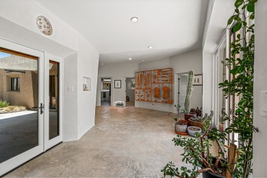 Live inside a work of art in this  Artist's Dream Dwelling in on Taos Country Club in New Mexico - for sale on GolfHomes.com, golf home, golf lot
