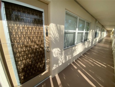 GATED COMMUNITY! ONE BED ONE BATH CONDO WITH LAKE VIEW FROM BACK on Wynmoor Golf Course in Florida - for sale on GolfHomes.com, golf home, golf lot