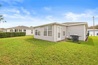 Welcome to this immaculately kept 2-bedroom, 2-bathroom bungalow on Tampa Bay Golf and Country Club in Florida - for sale on GolfHomes.com, golf home, golf lot