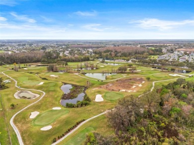 Welcome to this immaculately kept 2-bedroom, 2-bathroom bungalow on Tampa Bay Golf and Country Club in Florida - for sale on GolfHomes.com, golf home, golf lot